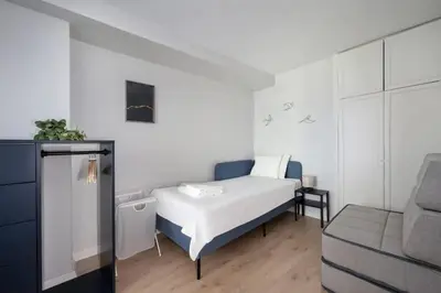 a small bedroom with a bed and a couch at Gorgeous Bright New 2BD Central Home! #212 in Istanbul