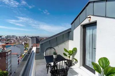 a balcony with a table and chairs on a building at Nex Hotel & Spa Istanbul in Istanbul