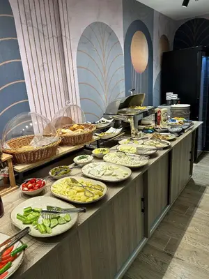 a buffet line with many plates of food at Mona Bosphorus Hotel in Istanbul