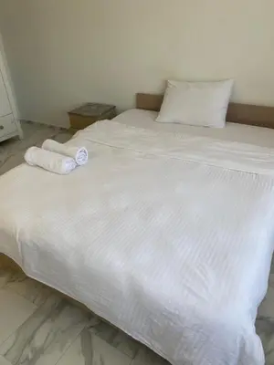 a large white bed with two towels on it at HOTEL YEDİkapı in Istanbul