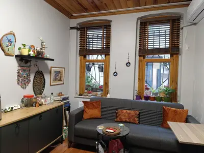 a living room with a couch and a table at NarPera Taksim Boutique Hotel in Istanbul