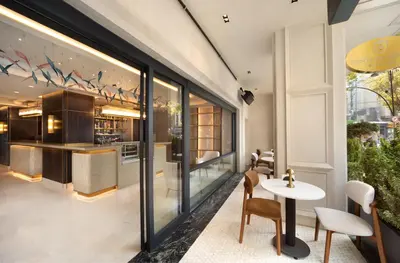 a dining room with a table and chairs and a window at Bentley Hotel Old City-Special Class in Istanbul