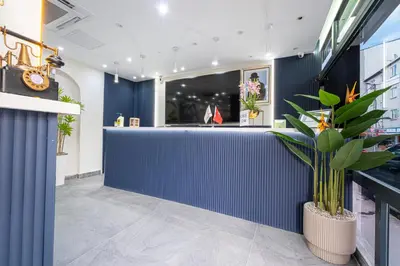 a blue wall in a store with a potted plant at Süper Stay Halkalı in Istanbul