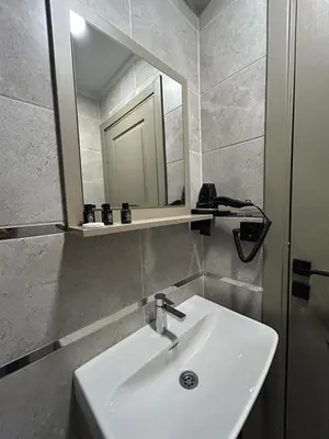 a bathroom with a sink and a mirror at Palma Suites in Istanbul