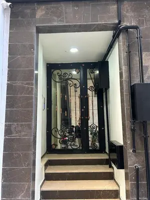 a black door with stairs in a building at Palma Suites in Istanbul