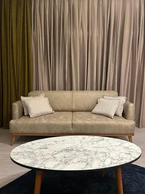 a living room with a couch and a coffee table at Palma Suites in Istanbul