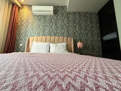 a bedroom with a large bed with a purple blanket at konforun adresi in Istanbul