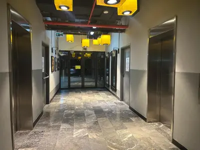 a hallway of an office building with elevators and doors at konforun adresi in Istanbul