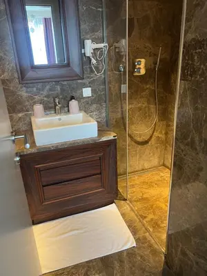 a bathroom with a sink and a shower at konforun adresi in Istanbul
