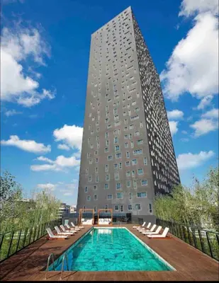 a building with a swimming pool in front of a building at konforun adresi in Istanbul