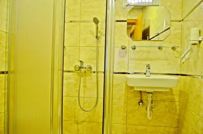 a bathroom with a shower and a sink at Yesilirmak Aparts in Istanbul