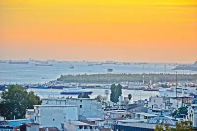 a city with buildings and boats in the water at Yesilirmak Aparts in Istanbul