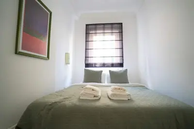 a bedroom with a bed with two towels on it at Duplex Modern City Gem with Terrace in Istanbul