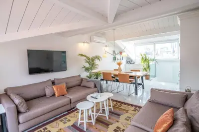 a living room with a couch and a table at Stylish Duplex in Beyoğlu with Private Terrace in Istanbul