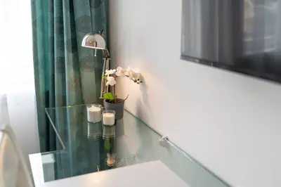 a bathroom with a glass sink and a mirror at Stylish Duplex in Beyoğlu with Private Terrace in Istanbul