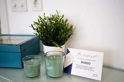 two glasses on a table with a box and a plant at Stylish Duplex in Beyoğlu with Private Terrace in Istanbul
