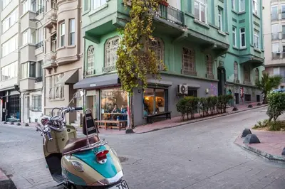 a scooter parked on the side of a street at Cozy Getaway - Warmth and Comfort in the City in Istanbul