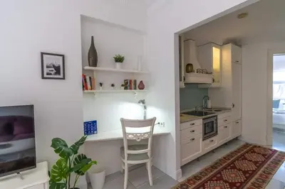 a kitchen with a desk and a chair in a room at Cozy Getaway - Warmth and Comfort in the City in Istanbul