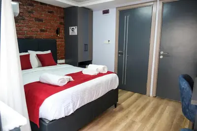a bedroom with a bed with towels on it at Yellow Mansion in Istanbul