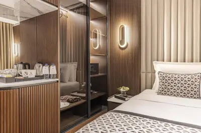 a hotel room with a bed and a bathroom at Dream Inn Karaköy Bosphorus in Istanbul
