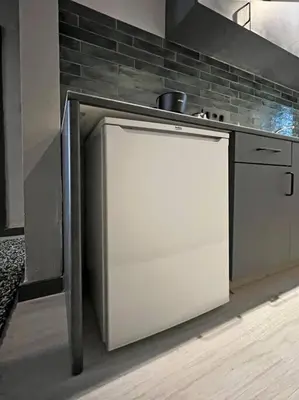 a kitchen with a white refrigerator and a stove at Central & cosy flat for 4 Person in Istanbul