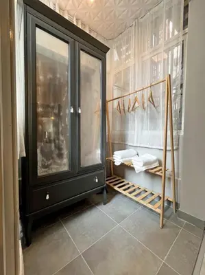 a room with a black cabinet and a shelf at Central & cosy flat for 4 Person in Istanbul