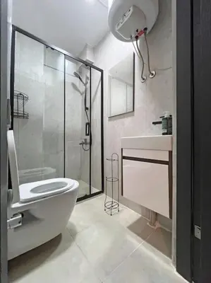 a bathroom with a shower and a toilet and a sink at Central & cosy flat for 4 Person in Istanbul