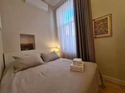 a bedroom with a bed with towels on it at Elegant, spacious, quiet 3br near historic center in Istanbul