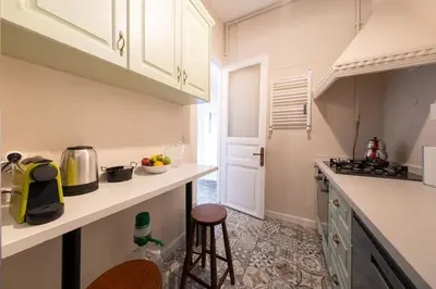 a kitchen with white cabinets and a counter top at Elegant, spacious, quiet 3br near historic center in Istanbul