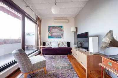 a living room with a couch and a chair at Magnificent view, in the center in Istanbul