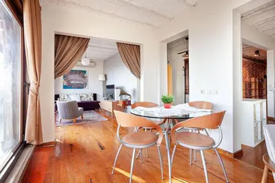 a dining room and living room with a table and chairs at Magnificent view, in the center in Istanbul