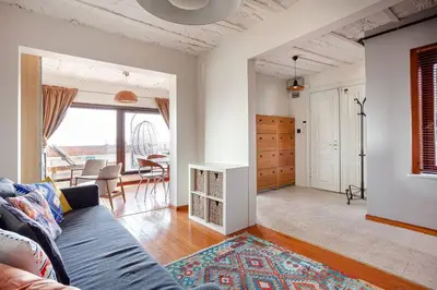 a living room with a couch and a dining room at Magnificent view, in the center in Istanbul