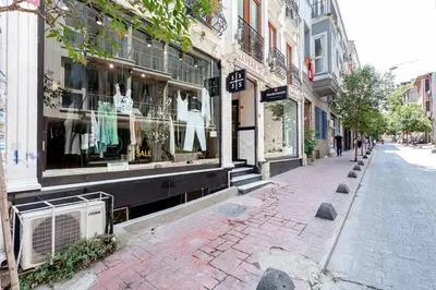 a city street with a store front with windows at Prime location with terrace in Istanbul