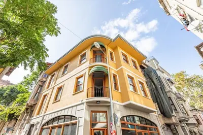 a yellow building with a round top at Beautiful Bright Cool Modern 1BD Balat Loft! #329 in Istanbul