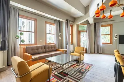 a living room with a couch and a table at Beautiful Bright Cool Modern 1BD Balat Loft! #329 in Istanbul