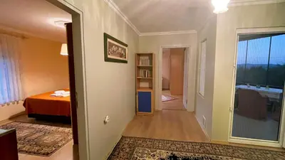 a hallway with a room with a bed and a window at Bizim Ev in Sapanca