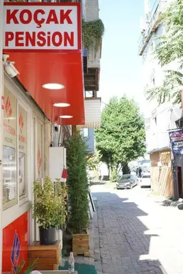 a sign for a kazak pension on a street at Koçak Pansiyon in Istanbul