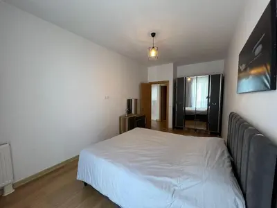 a bedroom with a white bed in a room at Cozy Home 1 Room 1 Living Room Apartment in Esenyurt