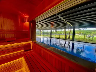a swimming pool seen from the inside of a sauna at Green Roof Boutique Hotel & SPA Istanbul Airport in Terkos