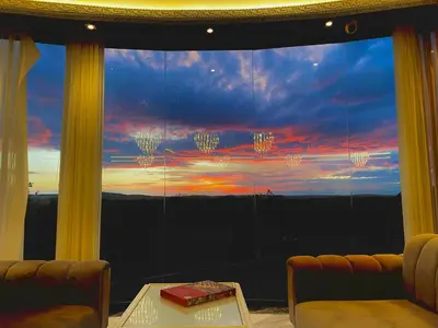 a room with a large window with a sunset at Green Roof Boutique Hotel & SPA Istanbul Airport in Terkos