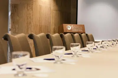 a row of tables with wine glasses on them at Fesa Business Hotel in Gebze