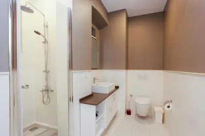 a bathroom with a toilet and a sink and a shower at Stay Juno in Istanbul