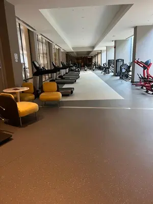 a gym with a row of chairs and treadmills at 4+1 daire in Istanbul