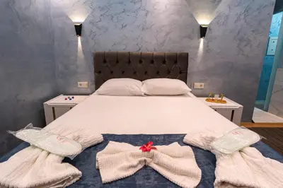 a bedroom with a bed with two towels on it at Stay Suite Hotel in Istanbul
