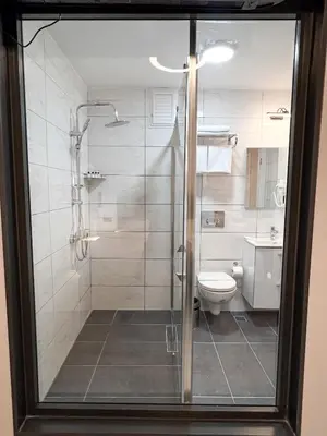 a bathroom with a shower and a toilet at Galata Inn Hotel in Istanbul