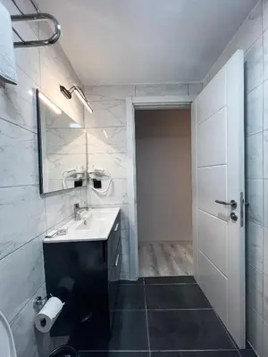 a bathroom with a sink and a mirror at Galata Inn Hotel in Istanbul