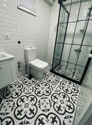 a bathroom with a toilet and a glass shower at The rooms hotel in Kumbağ