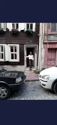 a woman standing in the doorway of a house at Newly renovated apartment-studio in Istanbul