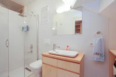 a bathroom with a sink and a shower and a toilet at Newly renovated apartment-studio in Istanbul