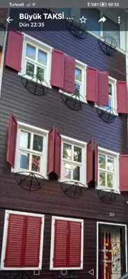 a building with red and white windows on it at Newly renovated apartment-studio in Istanbul